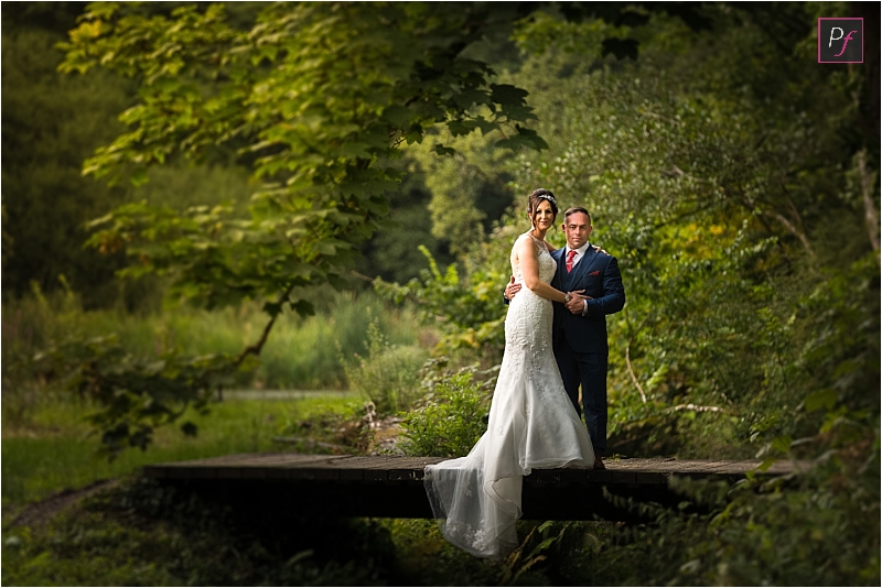 bride and groom on brdge