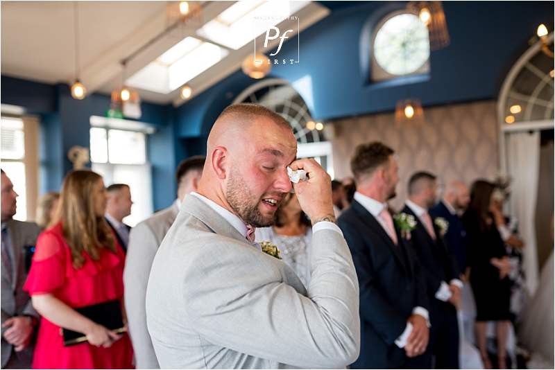 emotional groom at ceremony