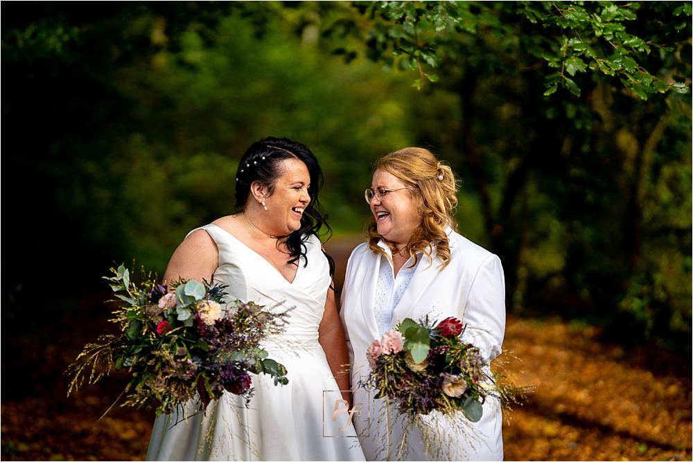 Bryngarw House Elopement: Intimate shot of the newlyweds under a canopy of greenery