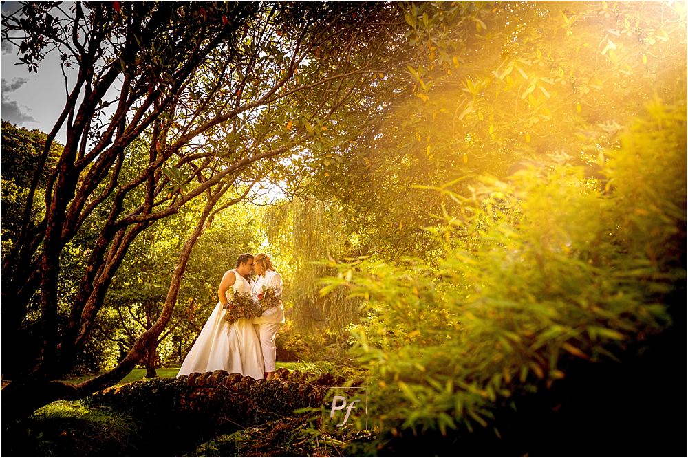 Couple bathed in the warm, soft light of the Bryngarw House sunset
