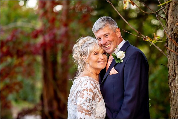 Happy Couple at Llanelli Wedding in LLwyn Hall Looking at Camera